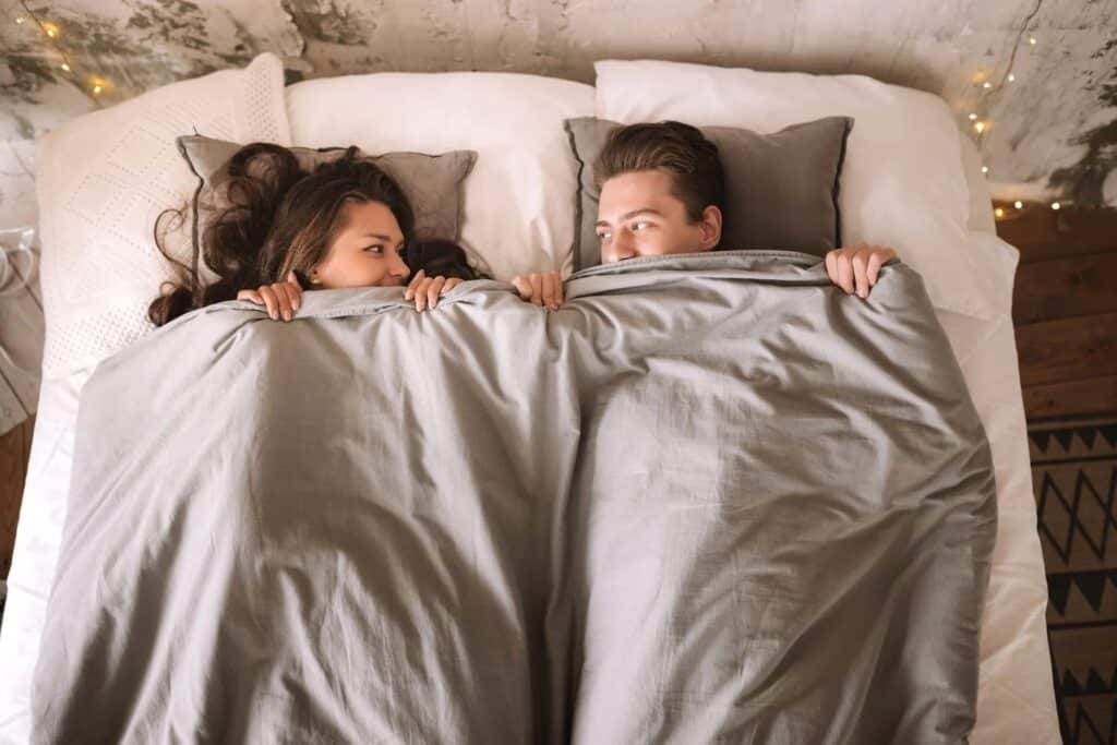 couple lying in bed together, concept of intimacy (3)