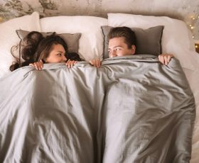 couple lying in bed together, concept of intimacy (3)
